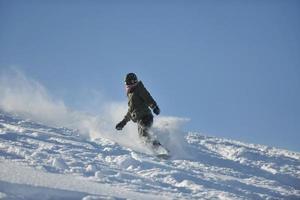 freestyle snowboarder jump and ride photo