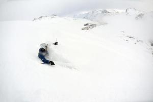 skiing on fresh snow at winter season at beautiful sunny day photo