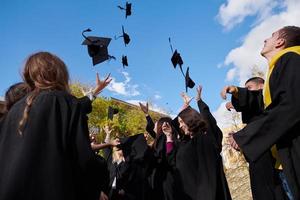 Group of diverse international graduating students celebrating photo