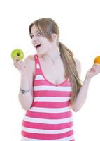 happy  young  woman eat apple isolated  on white photo