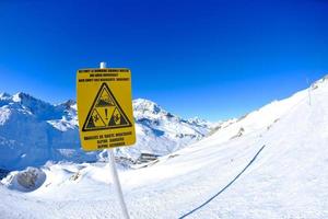Sign board at High mountains under snow in the winter photo
