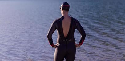 authentic triathlon athlete getting ready for swimming training on lake photo
