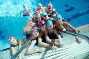 happy children group  at swimming pool photo