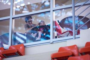 baby and mom looking trough window photo