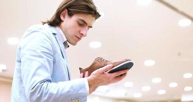 Man Chooses Shoes At Shoe Store photo