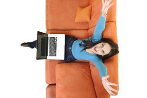 woman using a laptop computer at home photo