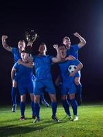 soccer players celebrating victory photo