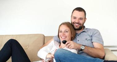 senoior couple watching tv in modern villa photo