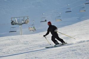 Skiers on mountain photo