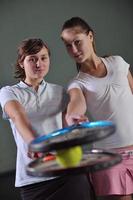 two woman tennis photo