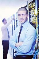 it engineers in network server room photo