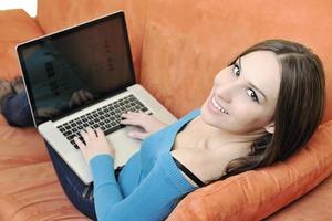 one young woman working on laptop photo