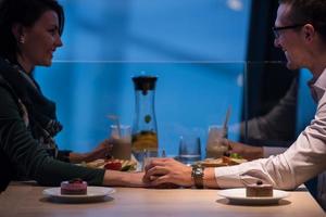 loving couple enjoying romantic dinner photo