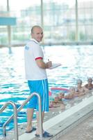 children group  at swimming pool photo