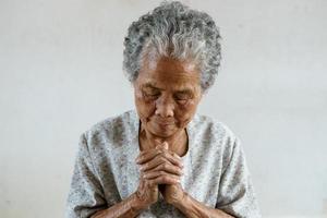 Pray of senior asian woman photo