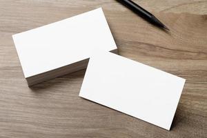 Minimal business card mockup on wooden desk photo