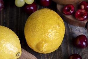 lemon on a cutting board, lying on a cutting board lemon and other products photo