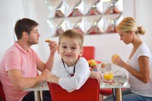 family have healthy breakfast at home photo