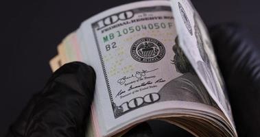 flip through and check American dollars, close up photo