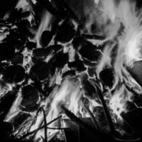 Fire flames on black background, Blaze fire flame texture background, Beautifully, the fire is burning, Fire flames with wood and cow dung bonfire Black and White photo