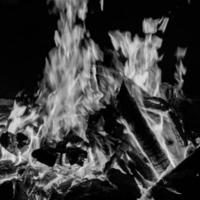Fire flames on black background, Blaze fire flame texture background, Beautifully, the fire is burning, Fire flames with wood and cow dung bonfire Black and White photo