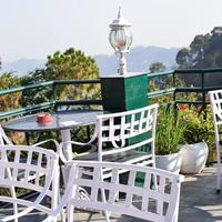 Early morning view of Modern rooftop restaurant at Kasauli, Himachal Pradesh in India, View of mountain hills from open air restaurant in Kasauli, Kasauli Rooftop restaurant photo