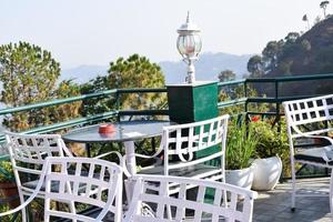 Early morning view of Modern rooftop restaurant at Kasauli, Himachal Pradesh in India, View of mountain hills from open air restaurant in Kasauli, Kasauli Rooftop restaurant photo