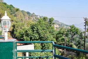 Early morning view of Modern rooftop restaurant at Kasauli, Himachal Pradesh in India, View of mountain hills from open air restaurant in Kasauli, Kasauli Rooftop restaurant photo