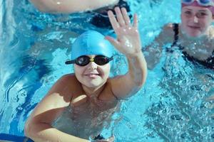 happy children group  at swimming pool photo