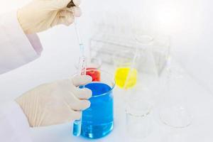 scientist hand holding laboratory test tube, science laboratory research and development concept photo
