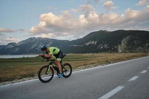 triathlon athlete riding bike photo