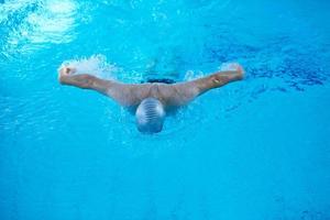 swimmer excercise on indoor swimming poo photo