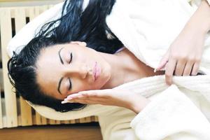 Young woman take a steam bath photo