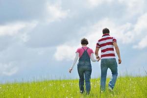 Portrait of romantic young couple smiling together outdoor photo