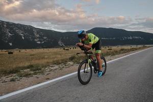 triathlon athlete riding bike photo