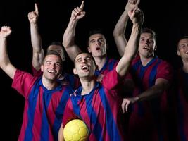 jugadores de fútbol celebrando la victoria foto