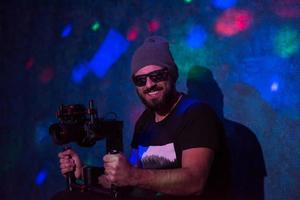 videographer in neon disco party photo