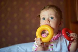 baby playing with toys at home photo