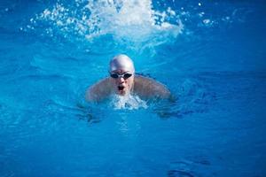 swimmer excercise on indoor swimming poo photo