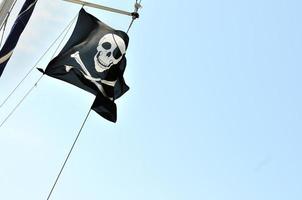 Pirate flag against sky photo