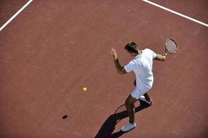 young man play tennis photo