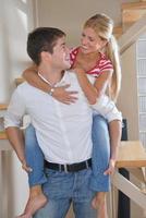 Relaxed young  couple watching tv at home photo