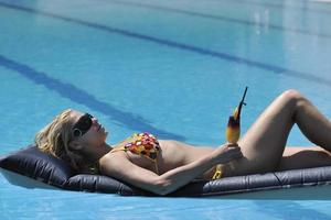 woman relax on swimming pool photo