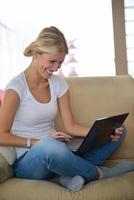 woman working on laptop at home photo