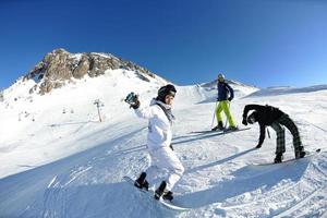 people group on snow at winter season photo