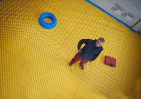 workers installing underfloor heating system photo