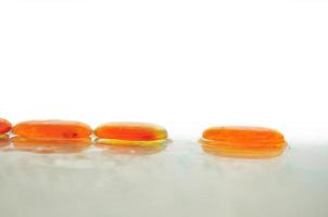 isolated wet zen stones with splashing  water drops photo