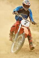 Riding a motocross bike photo