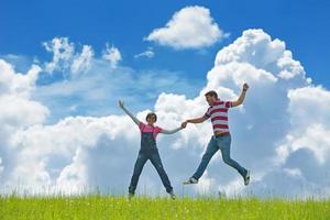 Portrait of romantic young couple smiling together outdoor photo