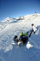 skiing on fresh snow at winter season at beautiful sunny day photo